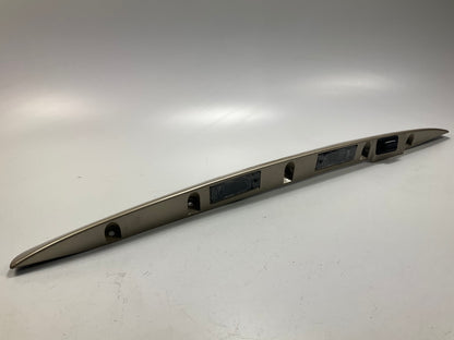 USED - 55155134AD Lift Gate License Plate Trim Champagne 99-04 Grand Cheroke