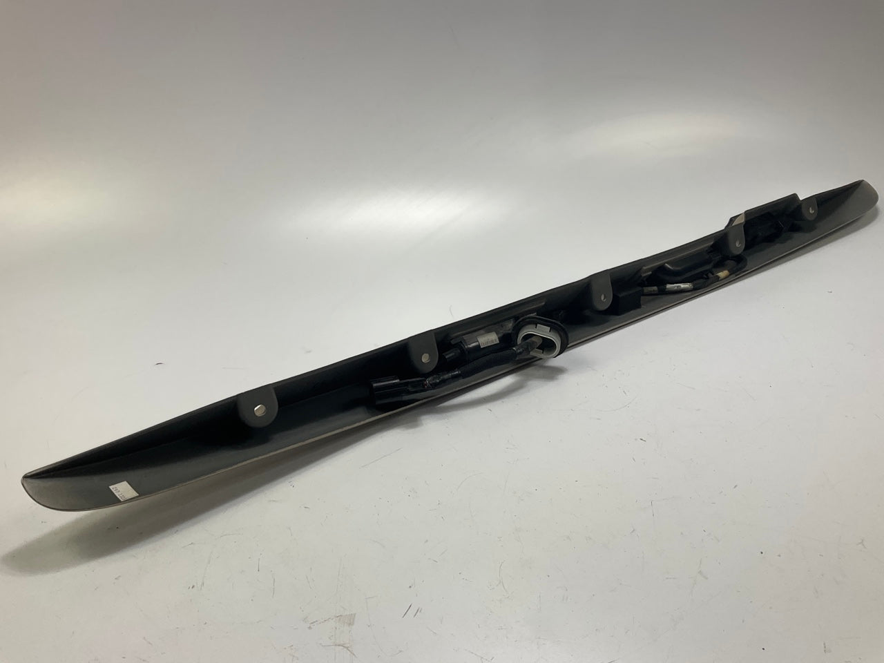USED - 55155134AD Lift Gate License Plate Trim Champagne 99-04 Grand Cheroke