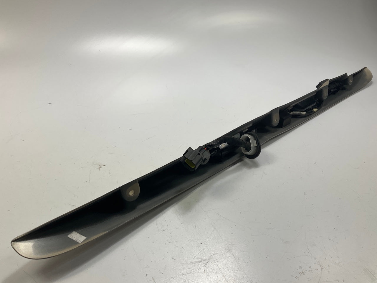 USED - 55155134AD Lift Gate License Plate Trim Champagne 99-04 Grand Cheroke