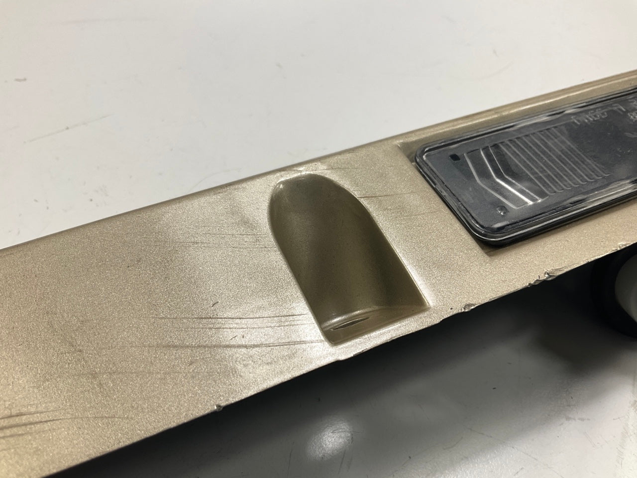 USED - 55155134AD Lift Gate License Plate Trim Champagne 99-04 Grand Cheroke