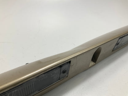 USED - 55155134AD Lift Gate License Plate Trim Champagne 99-04 Grand Cheroke