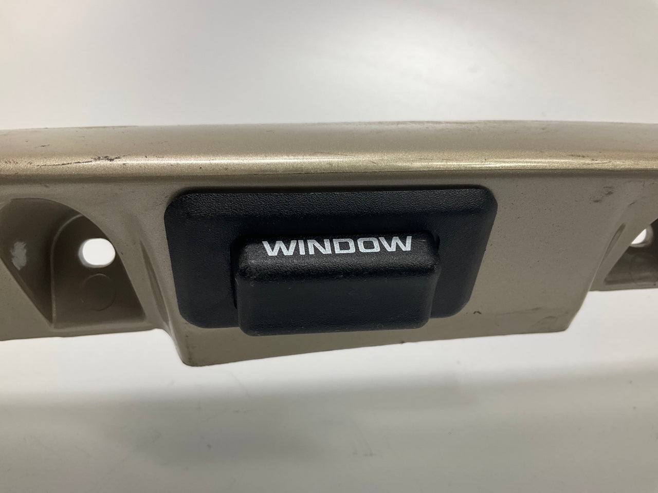 USED - 55155134AD Lift Gate License Plate Trim Champagne 99-04 Grand Cheroke