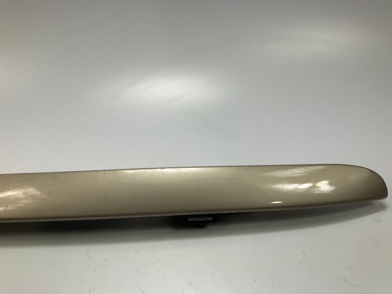USED - 55155134AD Lift Gate License Plate Trim Champagne 99-04 Grand Cheroke