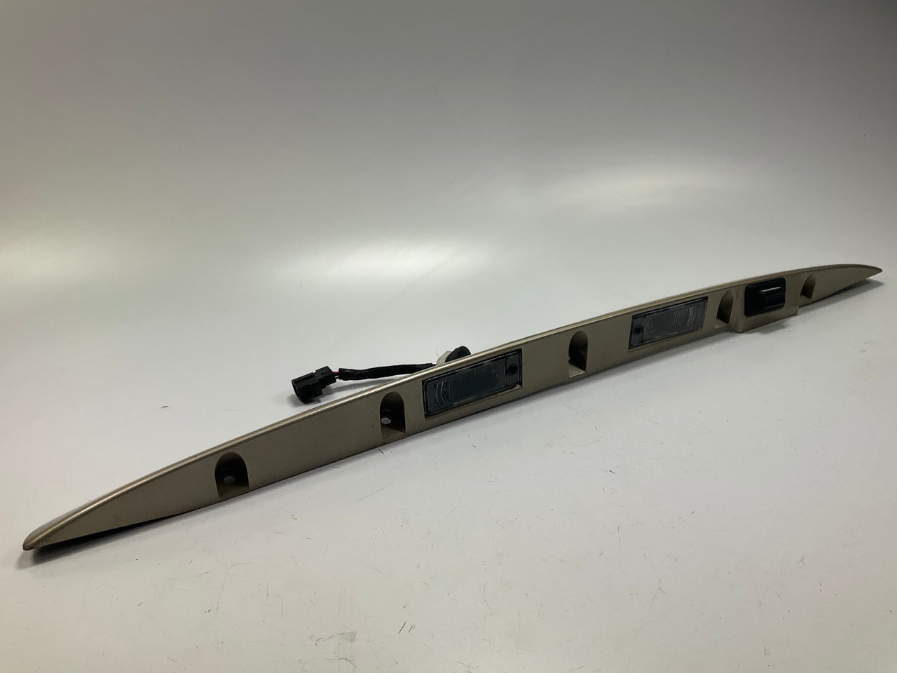 USED - 55155134AD Lift Gate License Plate Trim Champagne 99-04 Grand Cheroke