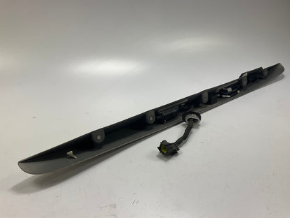 USED - 55155134AD Lift Gate License Plate Trim Champagne 99-04 Grand Cheroke