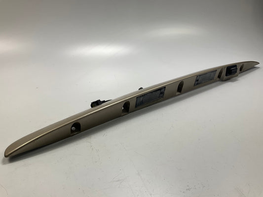 USED - 55155134AD Lift Gate License Plate Trim Champagne 99-04 Grand Cheroke