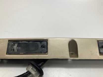 USED - 55155134AD Lift Gate License Plate Trim Champagne 99-04 Grand Cheroke