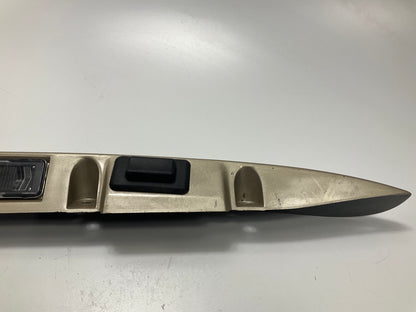 USED - 55155134AD Lift Gate License Plate Trim Champagne 99-04 Grand Cheroke