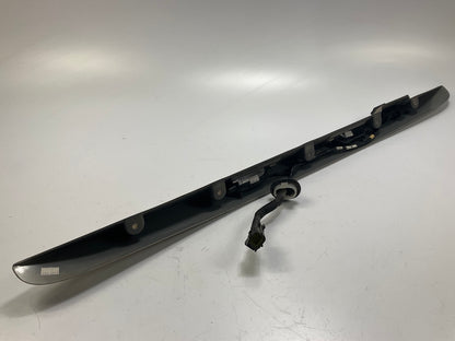 USED - 55155134AD Lift Gate License Plate Trim Champagne 99-04 Grand Cheroke