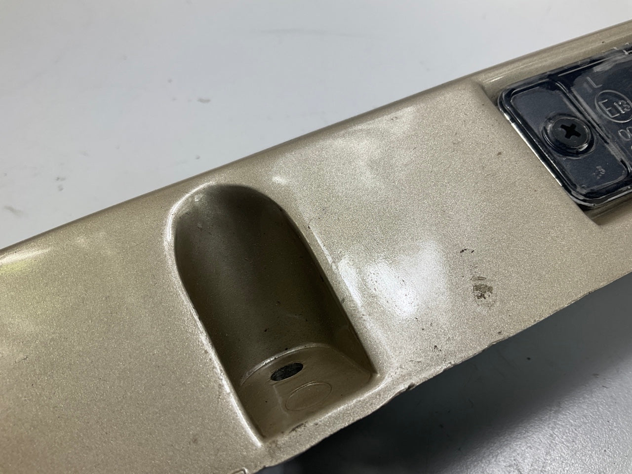 USED - 55155134AD Lift Gate License Plate Trim Champagne 99-04 Grand Cheroke