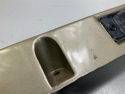 USED - 55155134AD Lift Gate License Plate Trim Champagne 99-04 Grand Cheroke