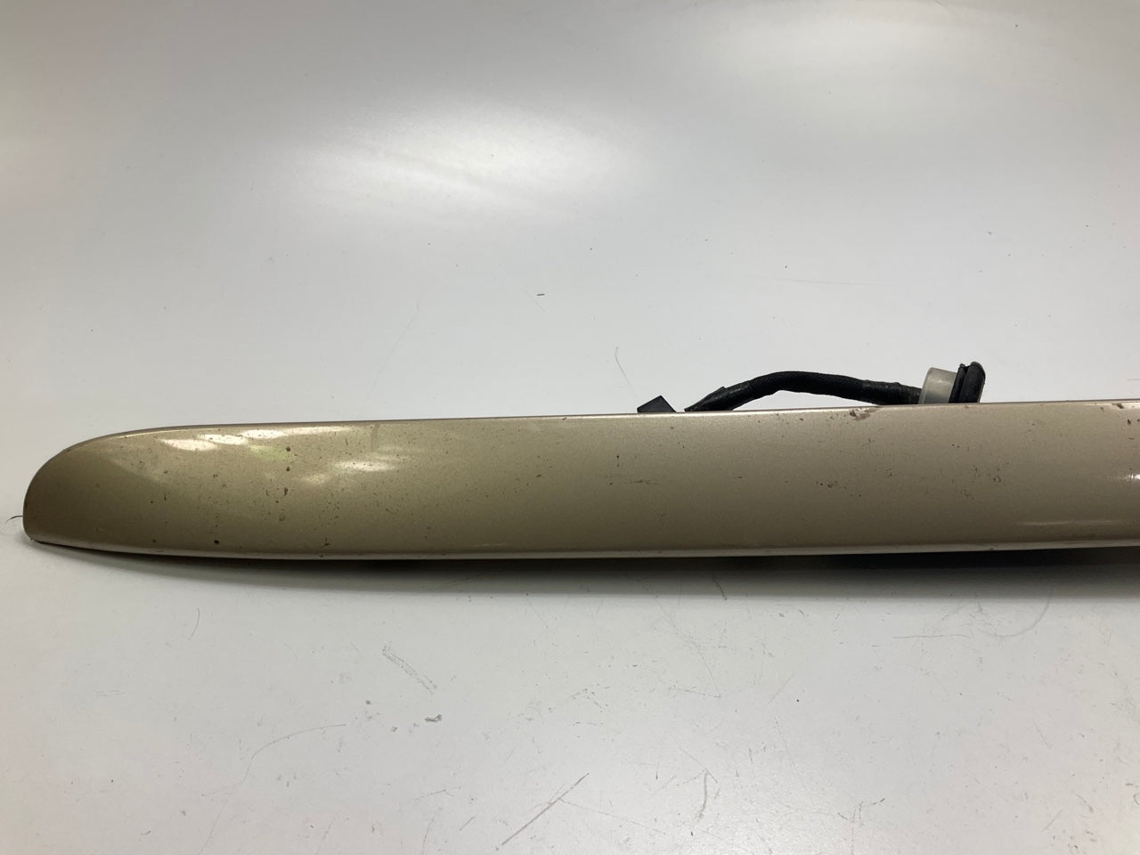USED - 55155134AD Lift Gate License Plate Trim Champagne 99-04 Grand Cheroke