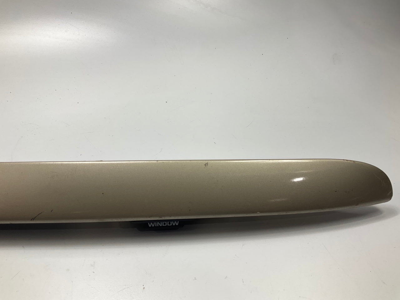 USED - 55155134AD Lift Gate License Plate Trim Champagne 99-04 Grand Cheroke