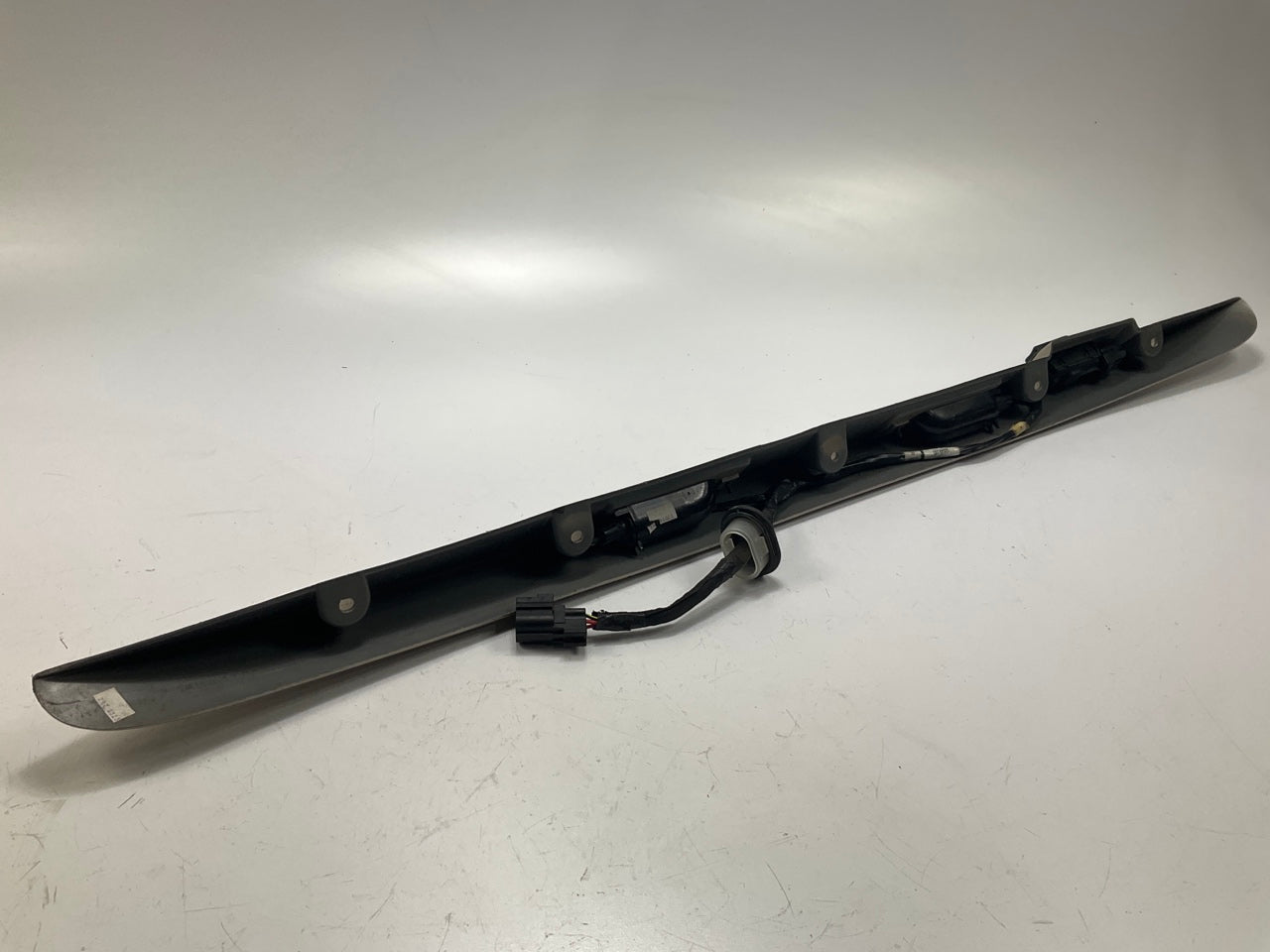 USED - 55155134AD Lift Gate License Plate Trim Champagne 99-04 Grand Cheroke