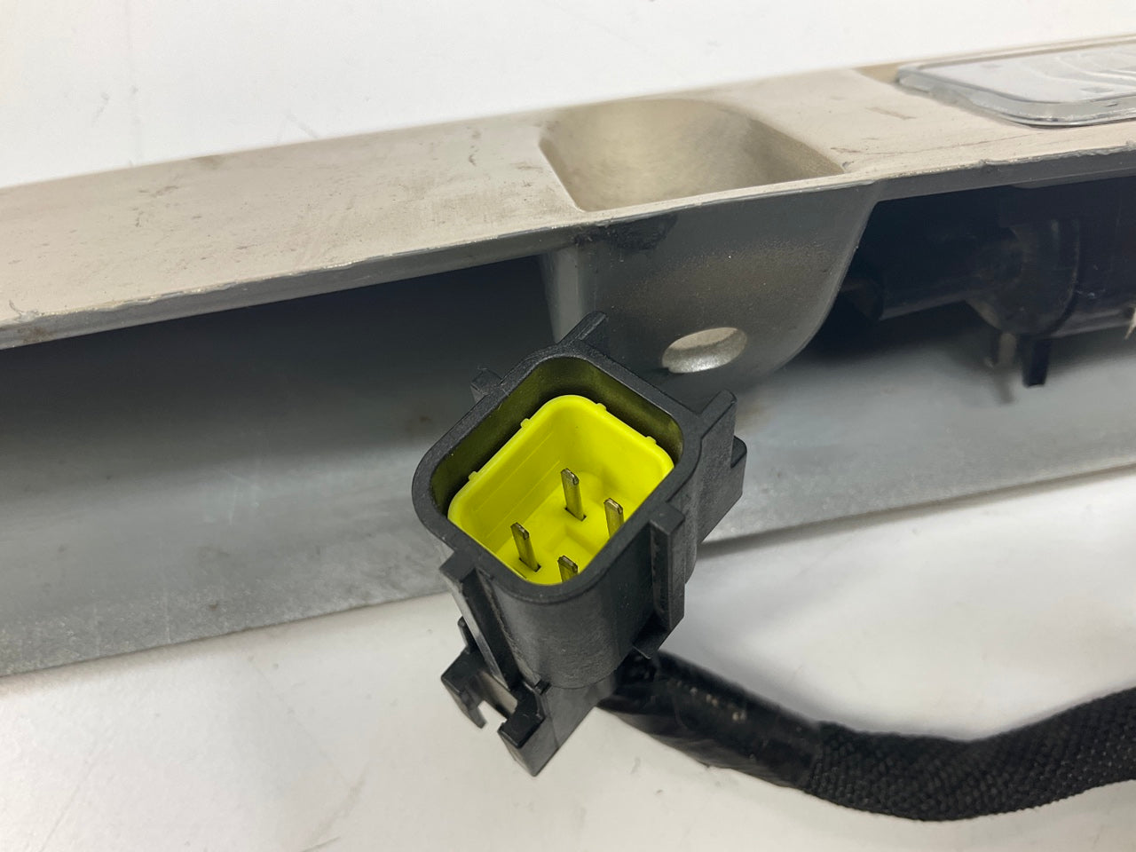 USED - 55155134AD Lift Gate License Plate Trim Champagne 99-04 Grand Cheroke
