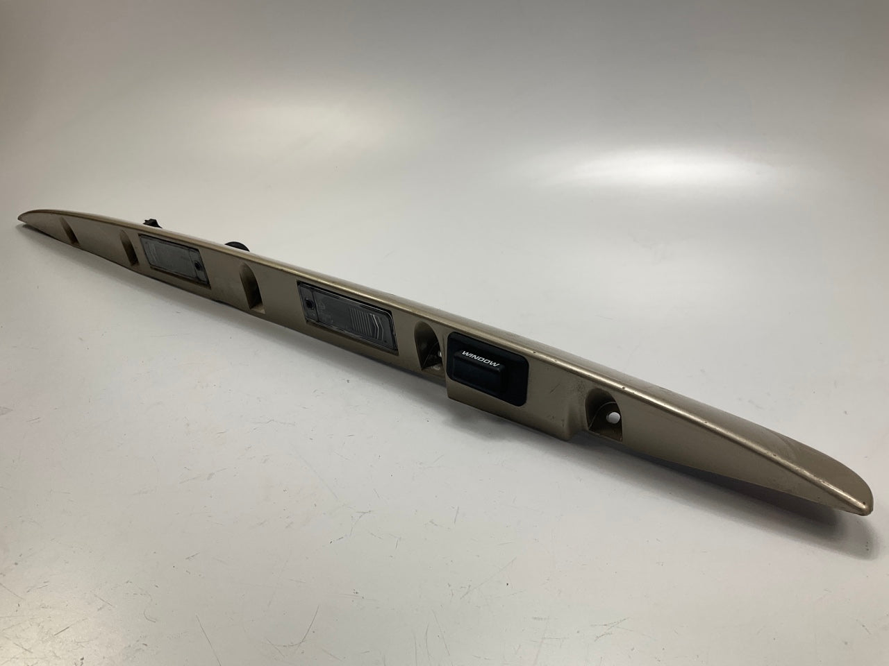 USED - 55155134AD Lift Gate License Plate Trim Champagne 99-04 Grand Cheroke