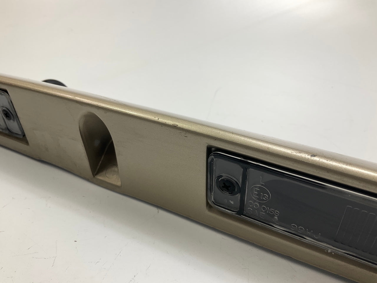 USED - 55155134AD Lift Gate License Plate Trim Champagne 99-04 Grand Cheroke