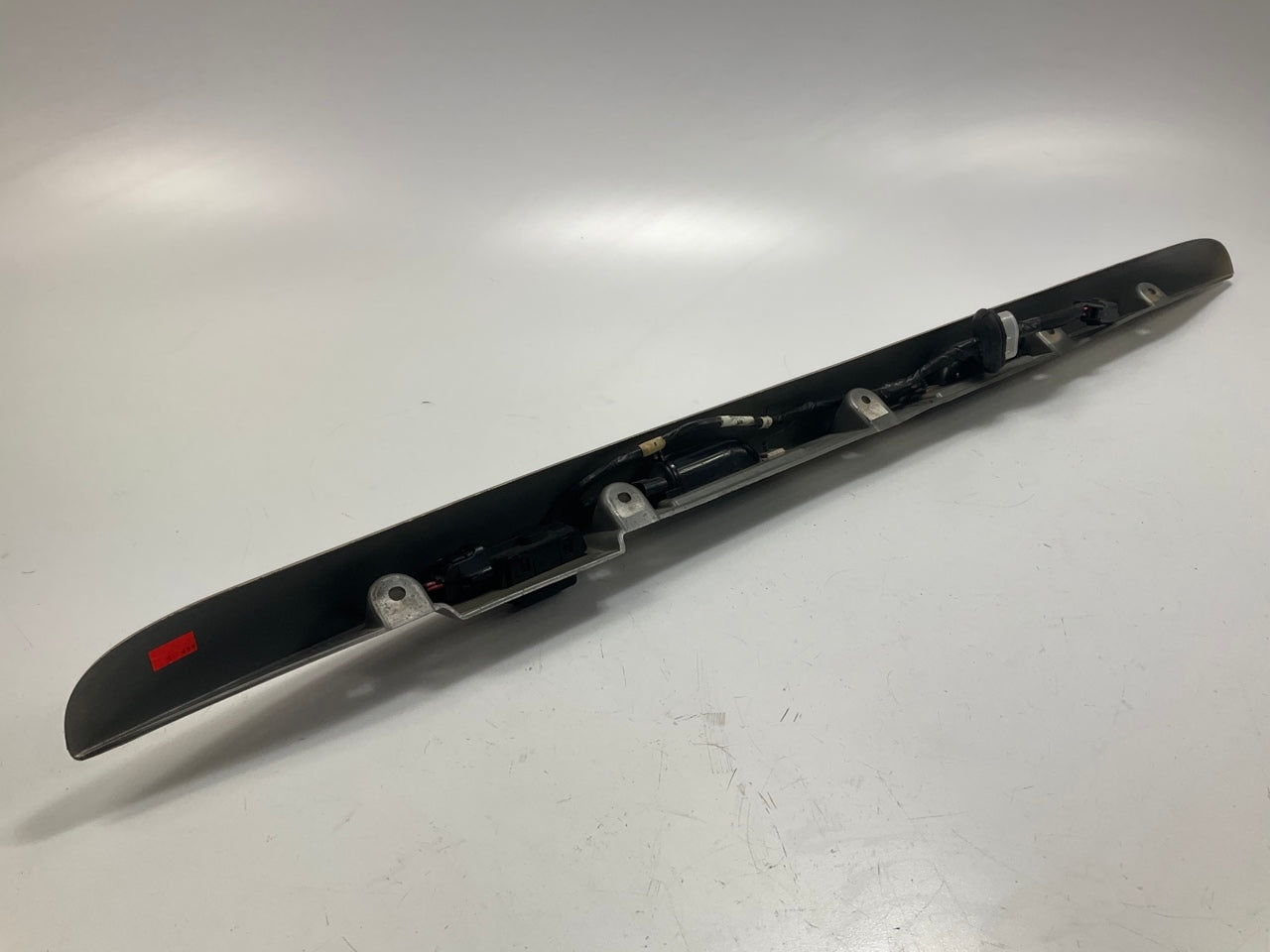 USED - 55155134AD Lift Gate License Plate Trim Champagne 99-04 Grand Cheroke