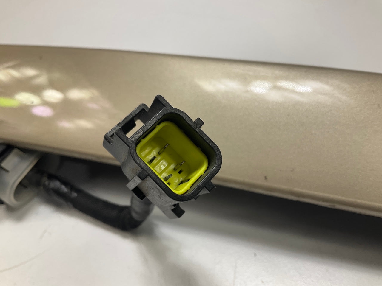 USED - 55155134AD Lift Gate License Plate Trim Champagne 99-04 Grand Cheroke