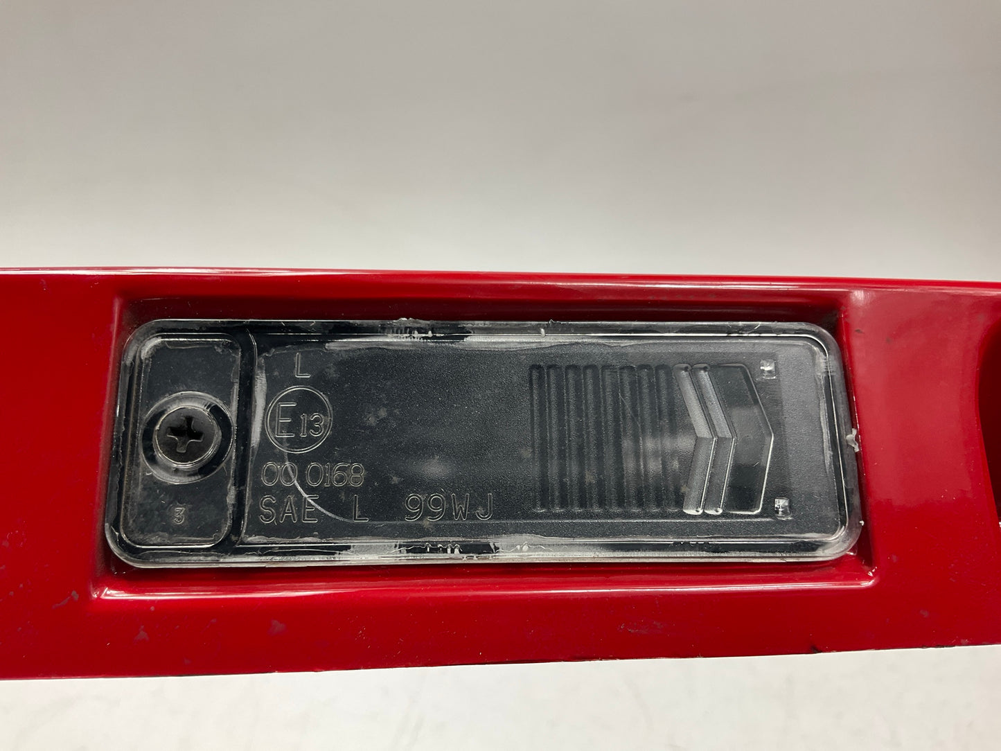 USED SCRATCHED - License Plate Lamp Light Trim Flame Red 99-04 Grand Cherokee