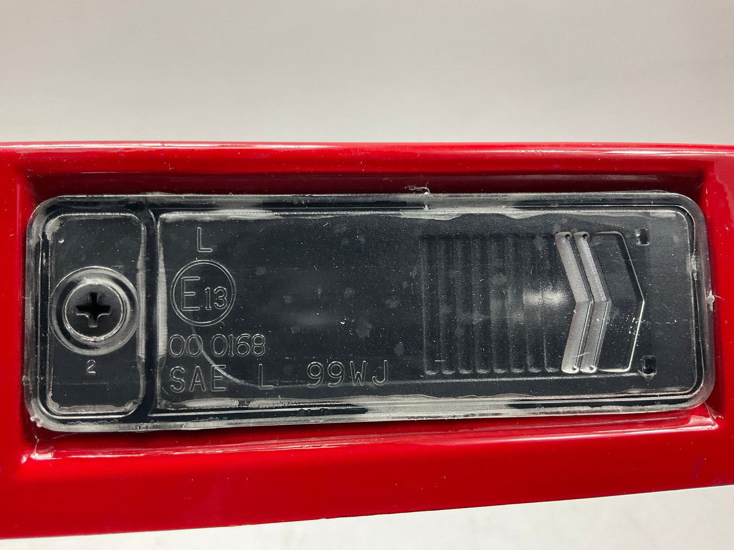 USED SCRATCHED - License Plate Lamp Light Trim Flame Red 99-04 Grand Cherokee