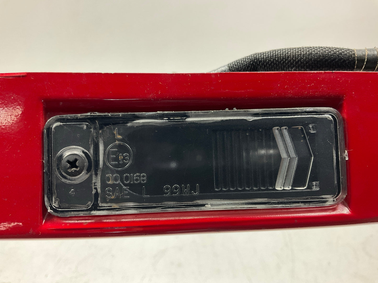 USED SCRATCHED - License Plate Lamp Light Trim Flame Red 99-04 Grand Cherokee