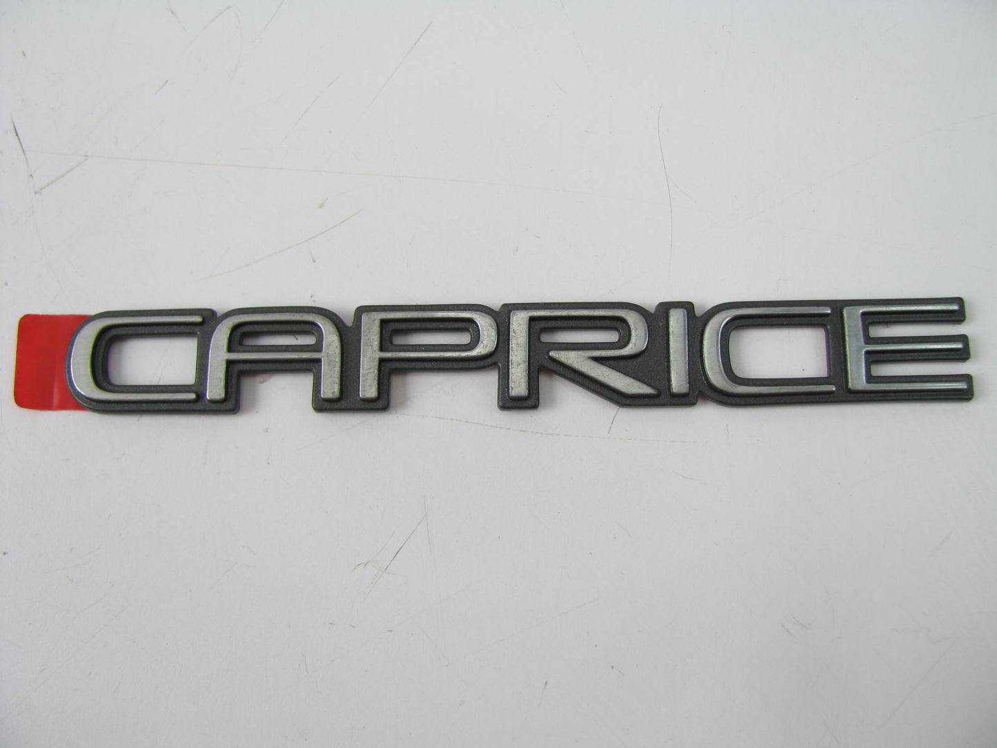 NEW - OUT OF BOX CAPRICE EMBLEM Name Plate Badge 5-1/2'' Long X 1/2'' High
