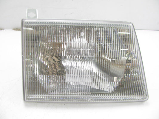 NEW - BUT SCRATCHED - OUT OF BOX OEM Ford F2UZ-13007-A Right Headlight Head Lamp