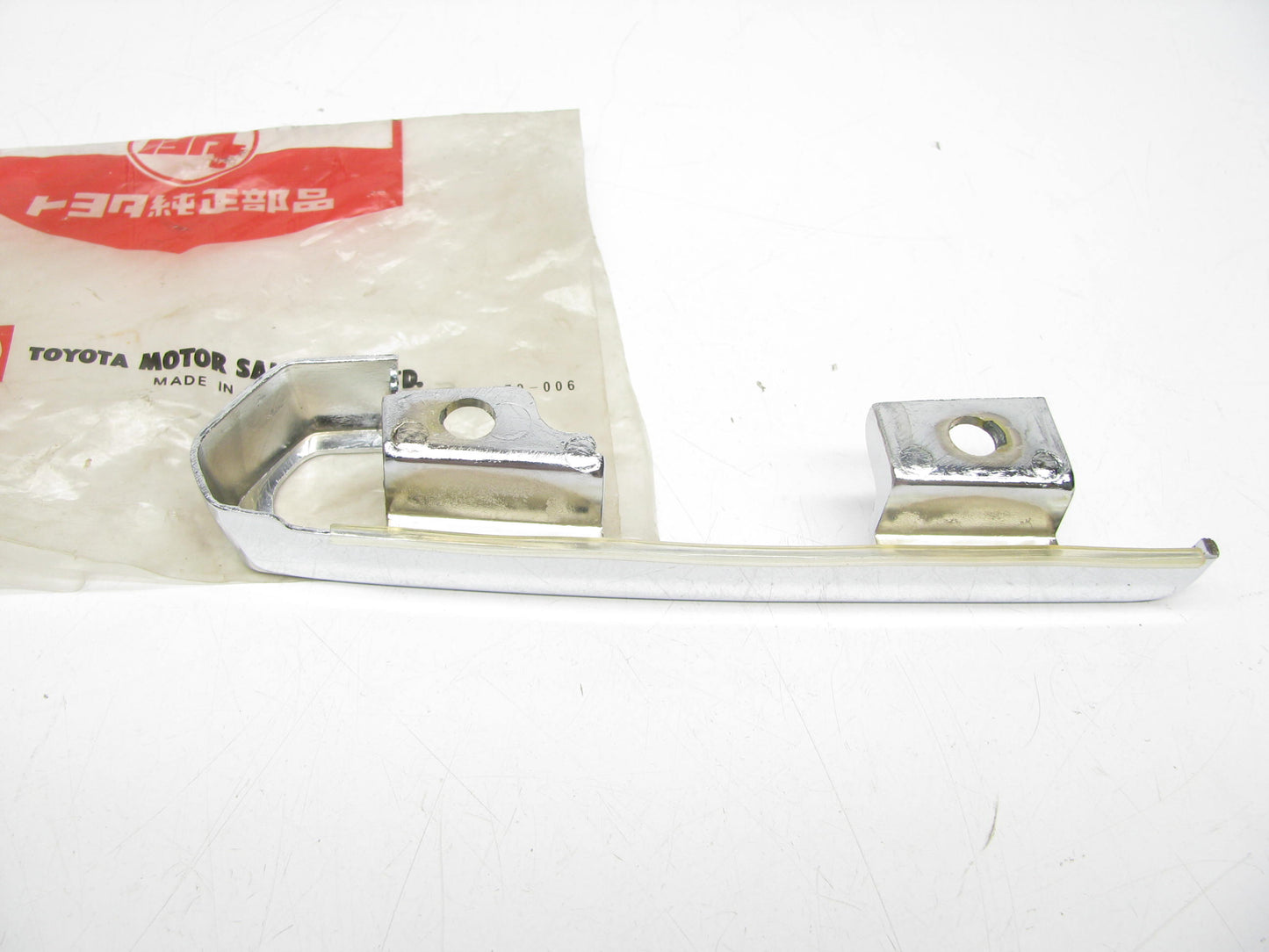 NOS OEM Chrome Light Trim Retainer Bracket  52125-30010