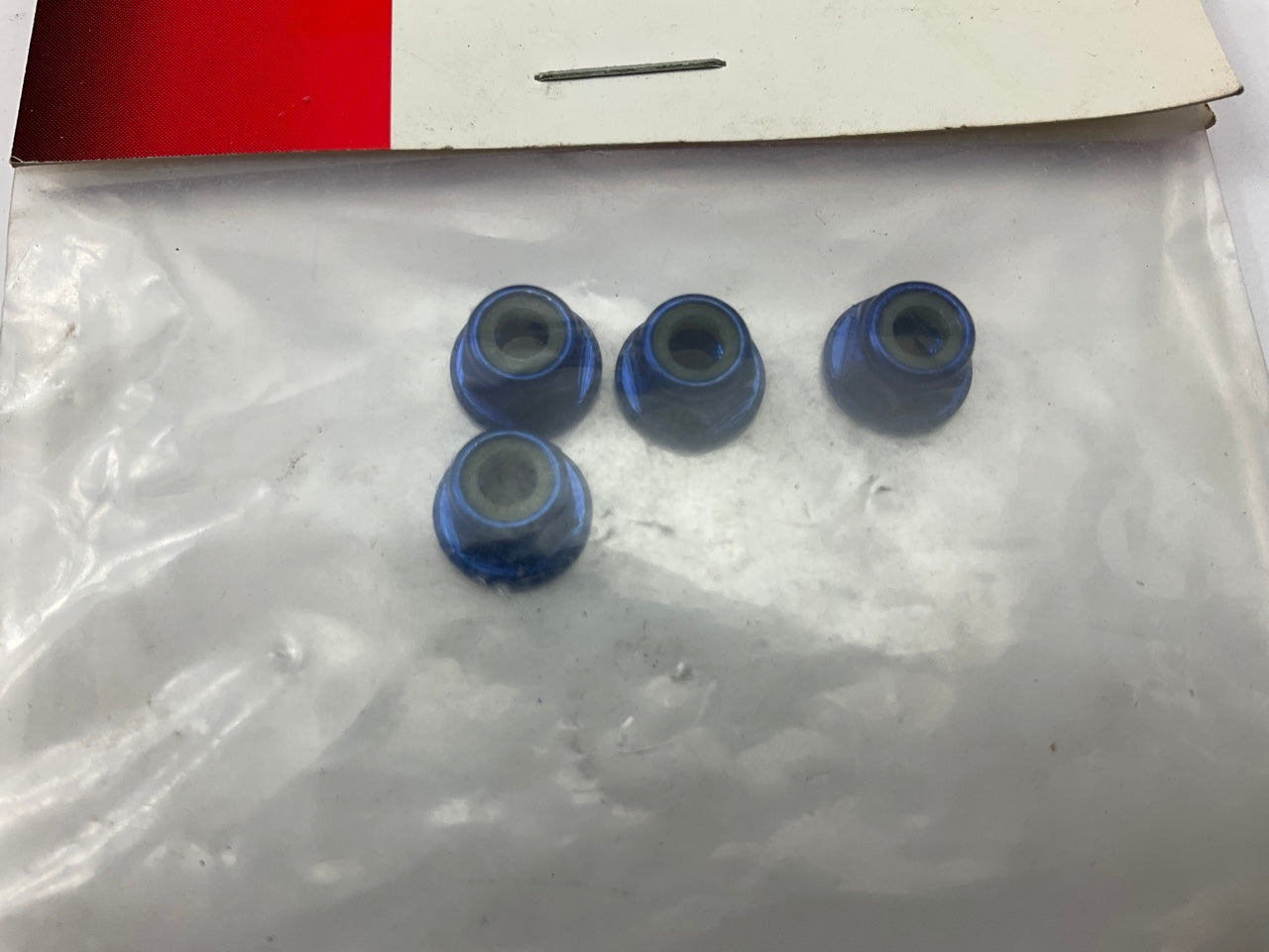 Traxxas 1747R 4mm Nuts Blue Aluminum Flanged Serrated Locknuts Slash Stampede