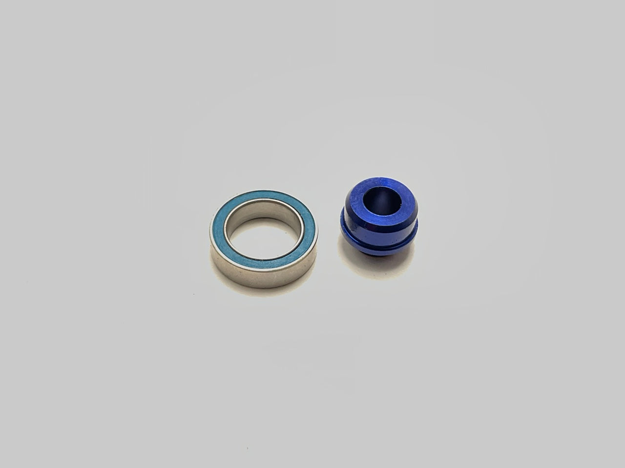 Traxxas 6893X - Aluminum Bearing Adapter Blue, Slash 4X4