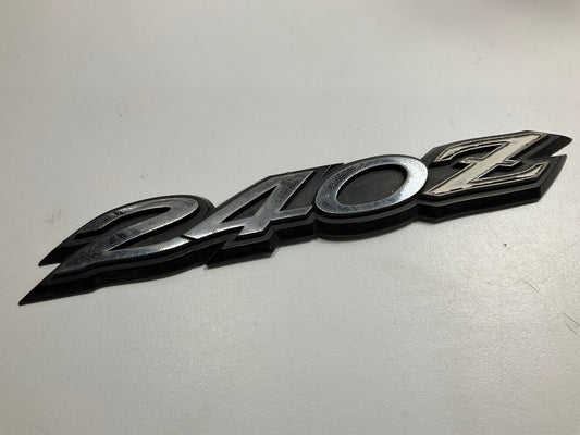 USED # 504 - Rear Hatch ''240z'' Emblem OEM For 70-73 Datsun 240z