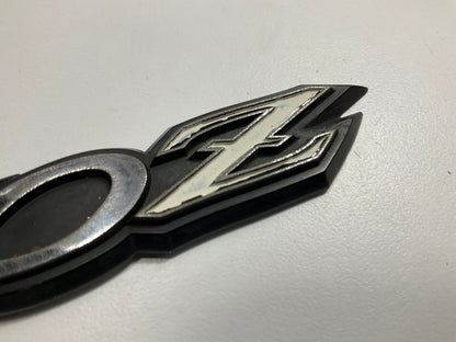 USED # 504 - Rear Hatch ''240z'' Emblem OEM For 70-73 Datsun 240z