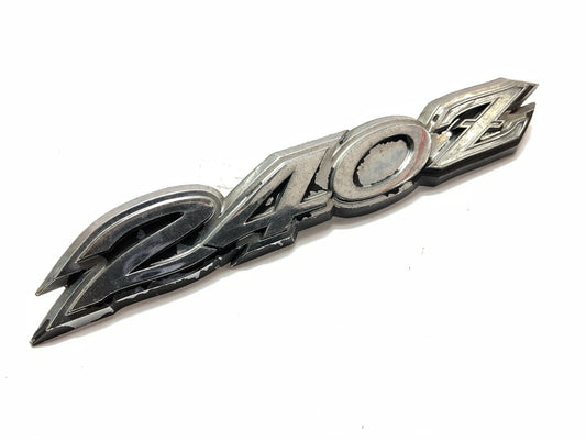 USED # 506 - Rear Hatch ''240z'' Emblem OEM For 70-73 Datsun 240z