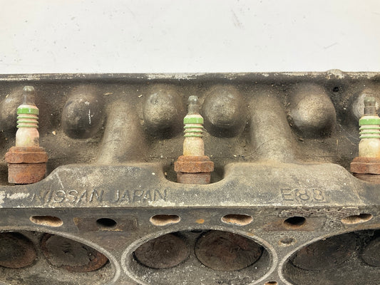 USED, BROKEN STUD - OEM For Datsun ''E88'' Core Cylinder Head COMES AS IS AS SHOWN