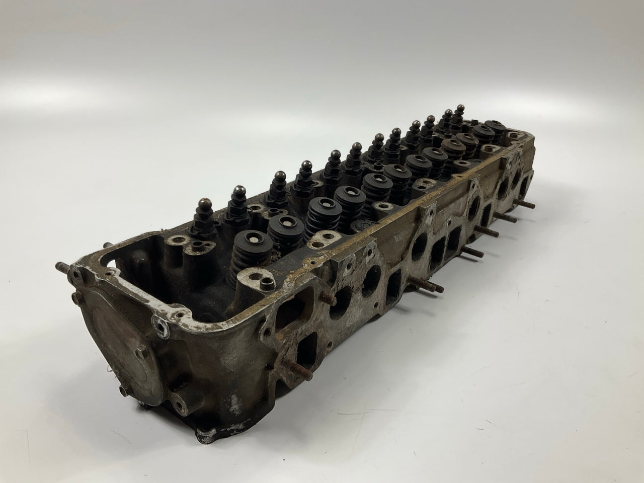 USED, BROKEN STUD - OEM For Datsun ''E88'' Core Cylinder Head COMES AS IS AS SHOWN